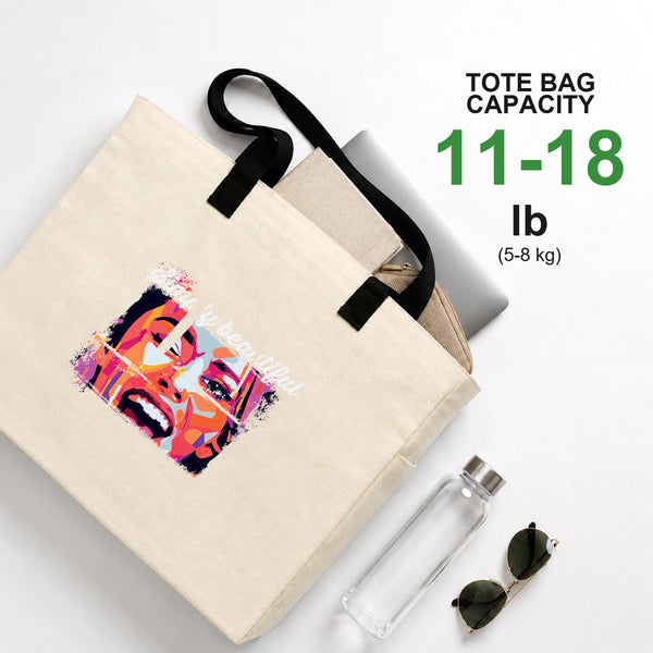 Printed canvas tote bag capacity 11-18 lb (5-8 kg) holding a laptop, water bottle and sunglasses