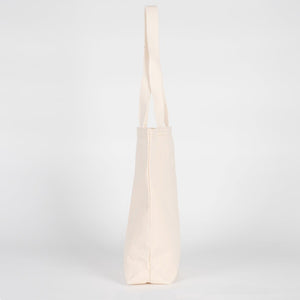 Beige tote bag on a light gray background